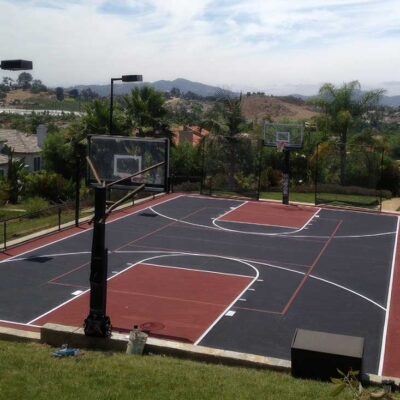 The Photo Shows A Multi-sports Court With A Full-size Basketball Court In Dark Blue With Red Keys, Red Surround And White Striping, And Red Pickleball Lines.