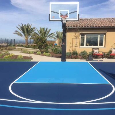 The Photo Shows A Residential Basketball Court In Some Beautiful Two-tone Blue Colors With White Striping.