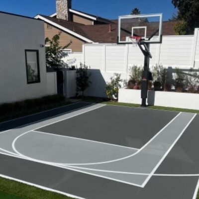 The Photo Shows A Small Residential Basketball Half-court, Slightly Modified, But Beautiful In Two-tone Grays.