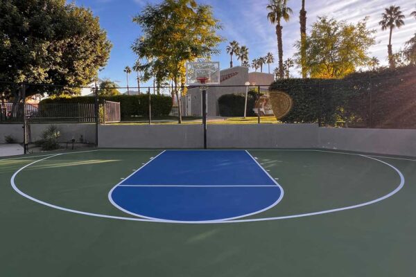The Photo Shows A New Basketball Court That Ferandell Tennis Courts Built For The Valley Palms Hoa In Indian Wells With A Blue Key/top Of Key, Green 3-point Area, And White Striping.