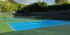 photo shows two pickleball courts in light blue with light green surrounds built at a private residence in la jolla california by ferandell tennis courts.