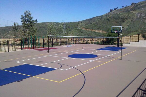 The Photo Shows A Multiple-sport Court With Black Lines For A Full-sized Basketball Court, White Lines For The Pickleball Courts, And Yellow Lines For The Volleyball Court.