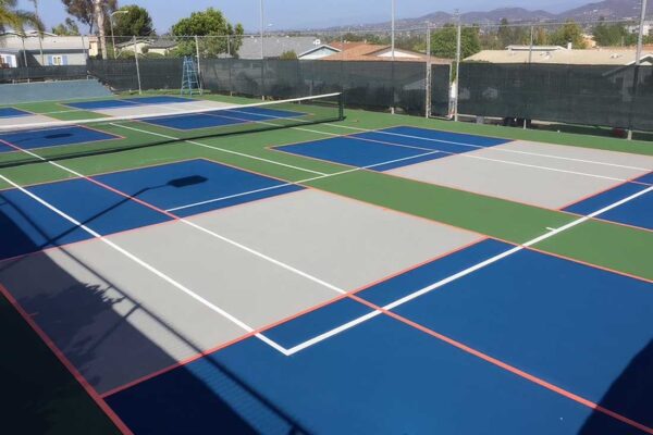 The Photo Shows A Multiple-sport Court Of Tennis Overlaid With Four Pickleball Courts.