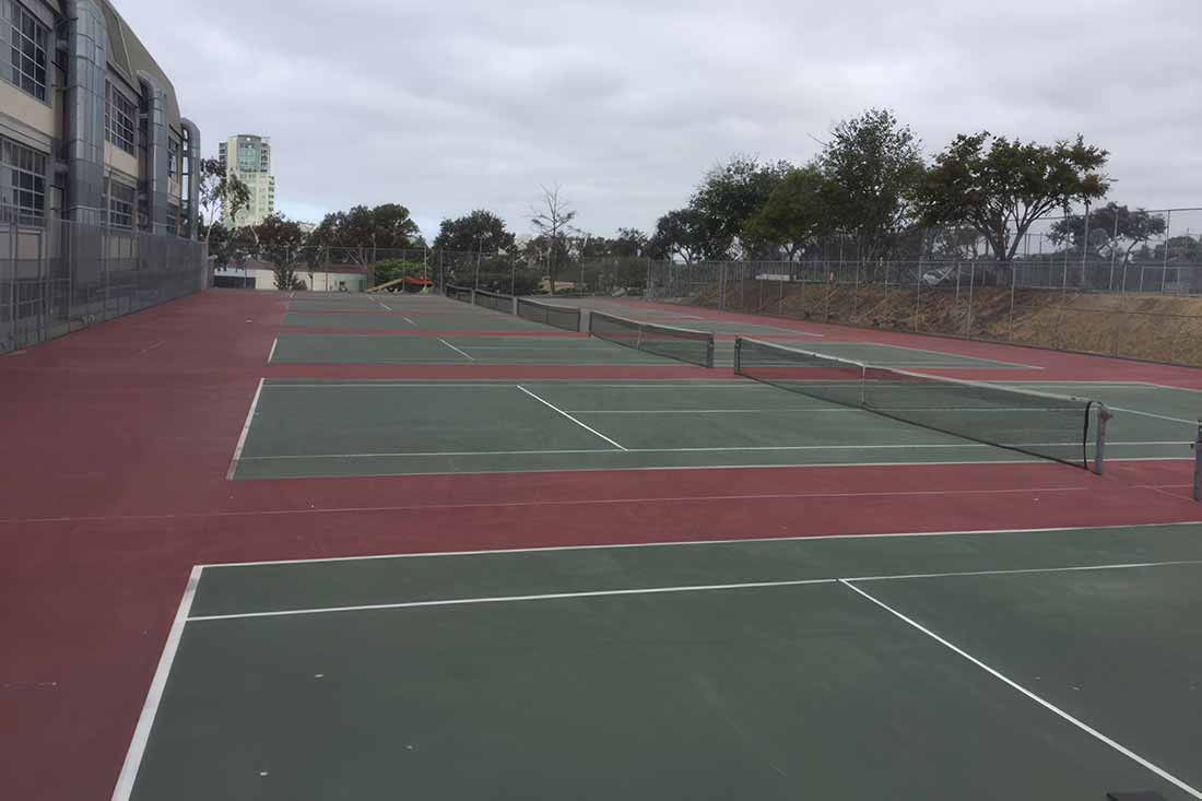 photo shows SD high school's tennis courts before resurfacing.