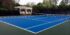 blue residential tennis court construction project with green surround and white striping completed in rancho santa fe by ferandell tennis courts;