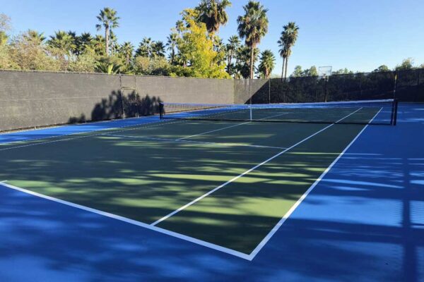 Ferandell Tennis Courts Built This Beautiful Tennis Court With A Very Popular Color Palette Of Blue And Green.
