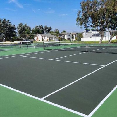 Tennis Court And Several Pickleball Courts Built In Dark Green With Light Green Surrounds By Ferandell Tennis Courts In San Marcos, California