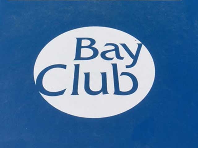 bay club logo stenciled onto their shuffle board court