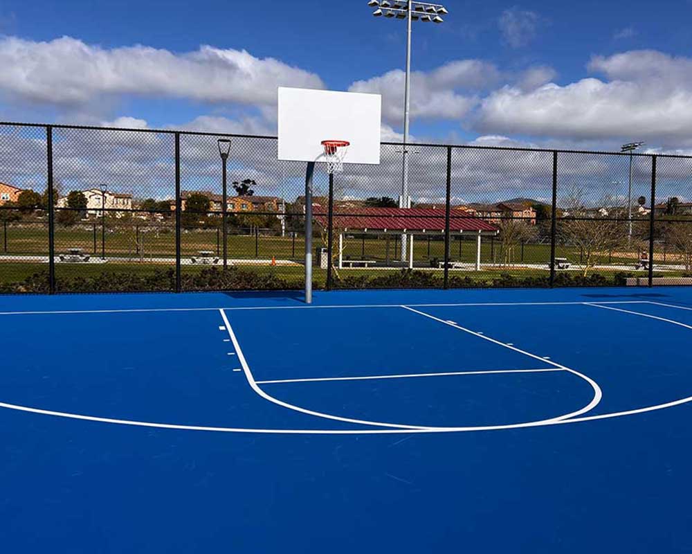 photo shows a stunning bright royal blue basketball court!