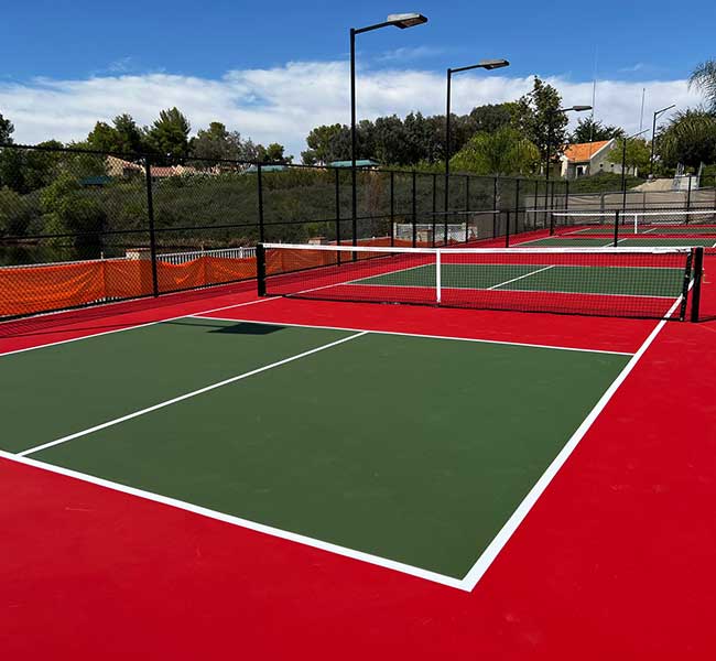 photo shows a striking new green on red pickleball court built by ferandell tennis courts