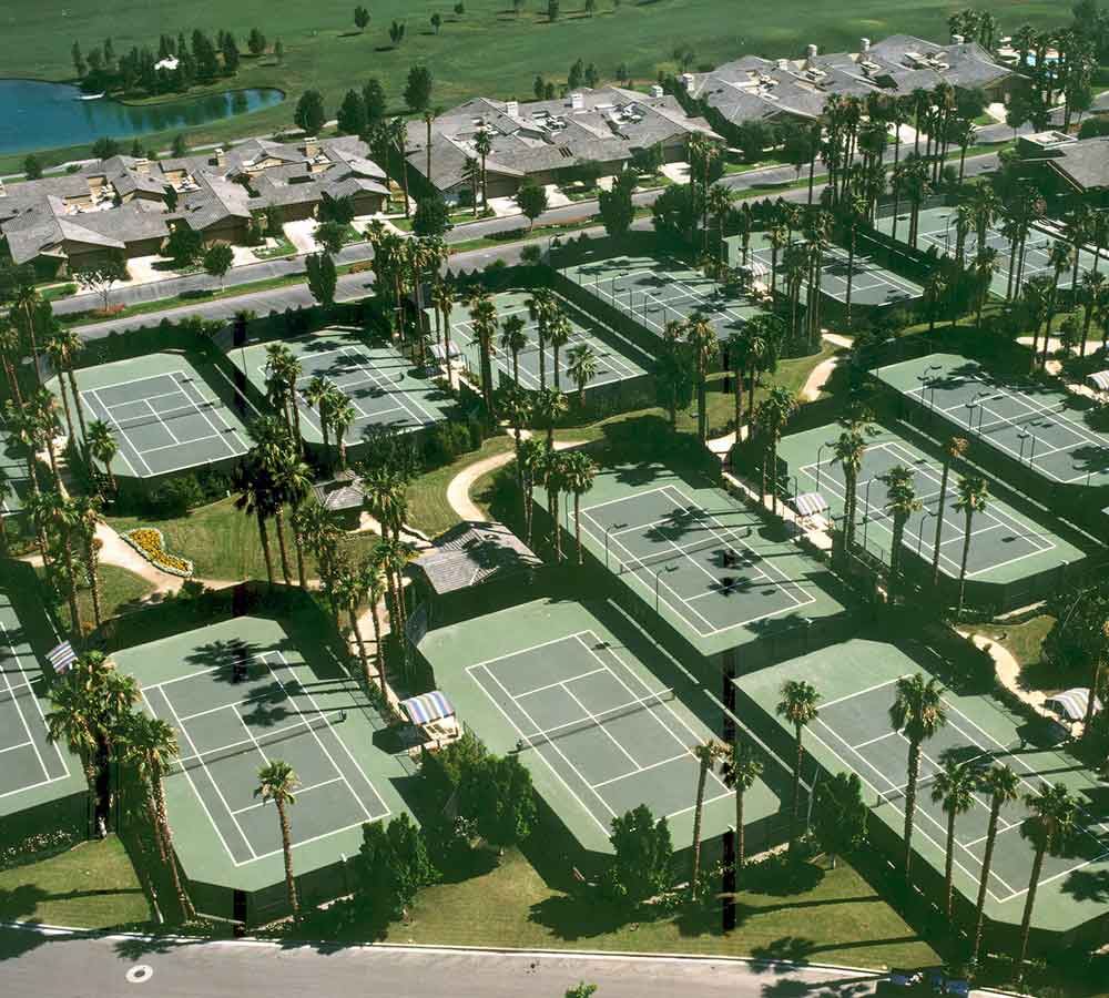 photo shows an aerial view of several country club tennis courts built by Ferandell Tennis Courts